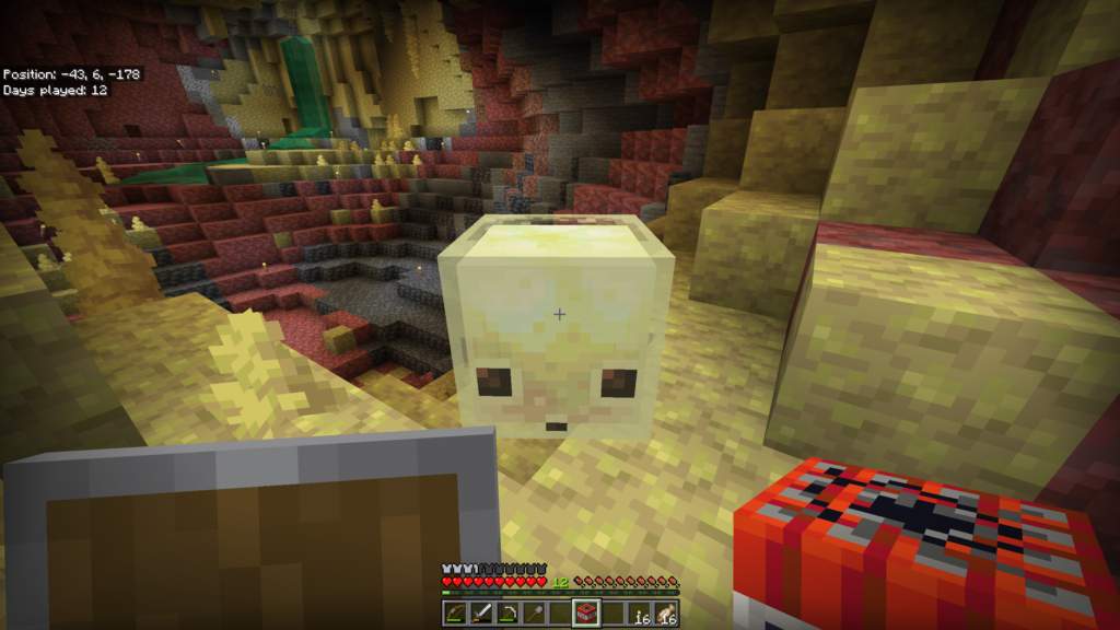 A sulfur cube in its natural habitat, with a player holding TNT ready to earn the new Uh-oh achievement.