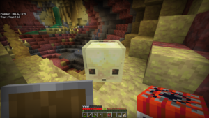 A sulfur cube in its natural habitat, with a player holding TNT ready to earn the new Uh-oh achievement.